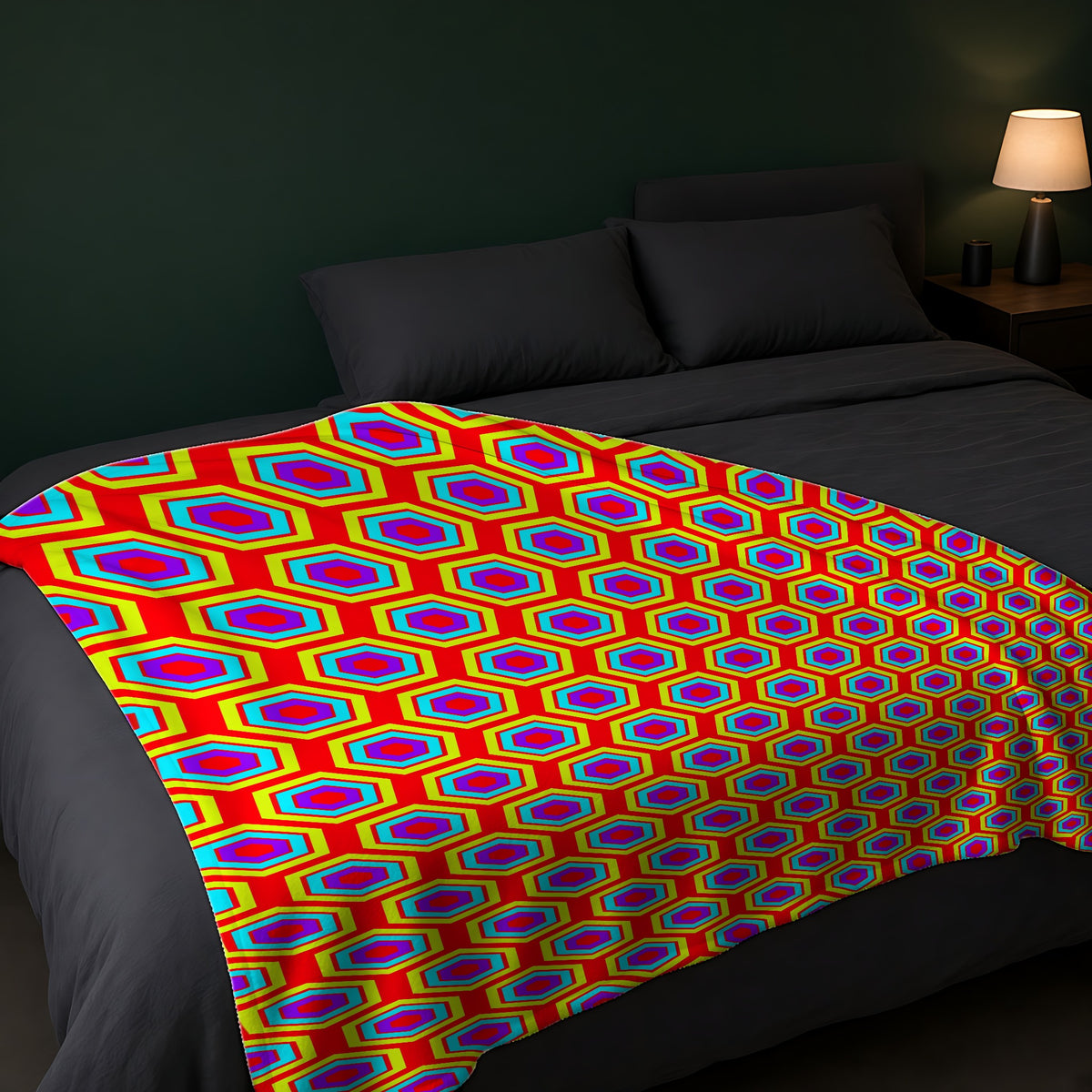 Concentric Hexagon Ripple Sherpa Fleece Blanket across the foot of a dark bed