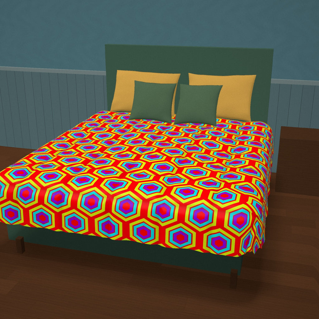 Concentric Hexagon Ripple Comforter on a made bed