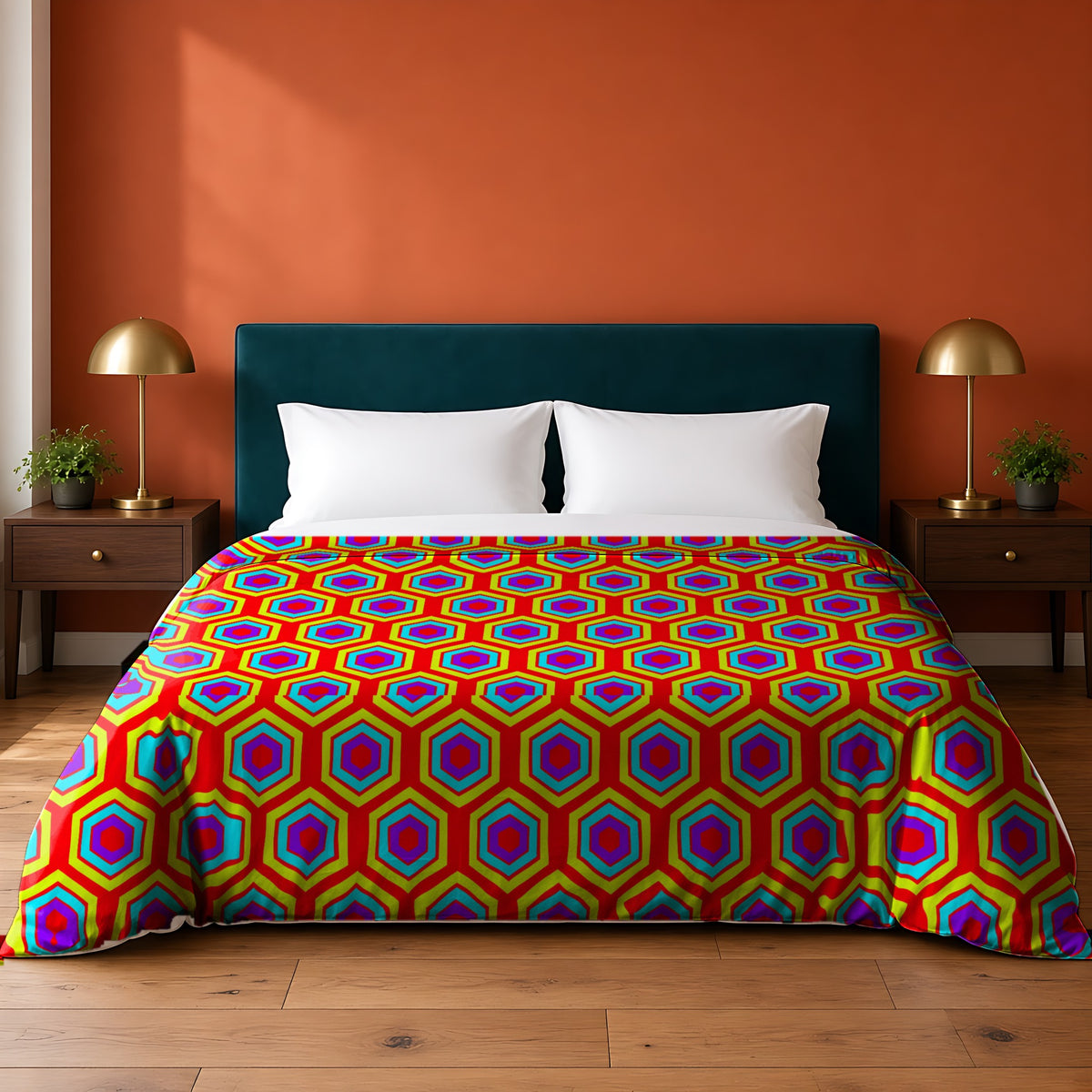 Concentric Hexagon Ripple cotton duvet cover in the Chromatic Ripple palette, on a bed with a teal headboard against a terracotta wall