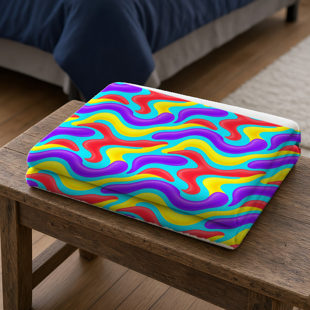 Liquid Band Ripple Sherpa Fleece Blanket folded on a wooden bench