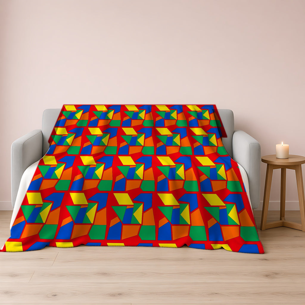 Cubist Block Quilt Sherpa Fleece Blanket draped over a grey sofa