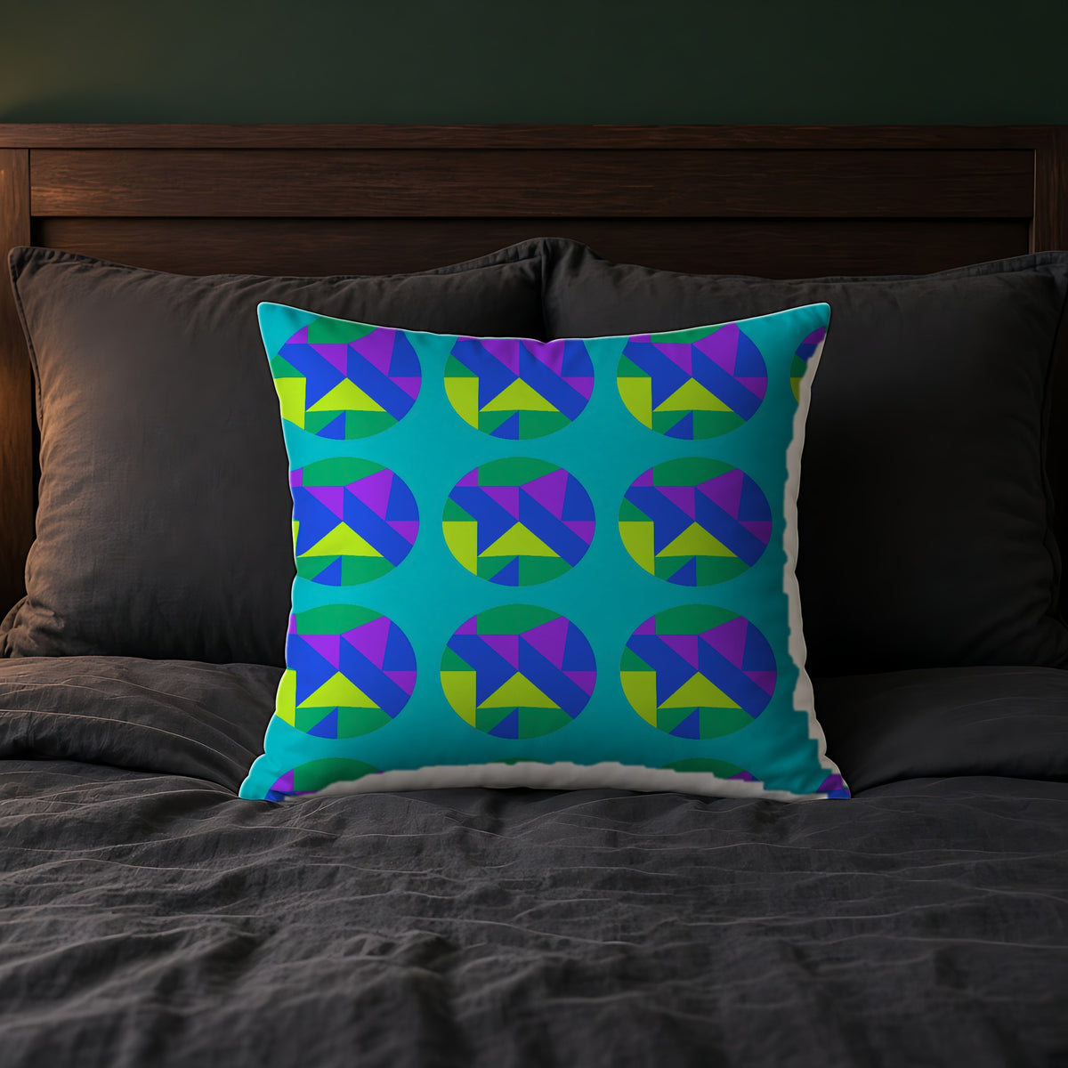 Broken Circle Planes Faux Suede Cushion in Peacock Jewel on a bed with charcoal bedding