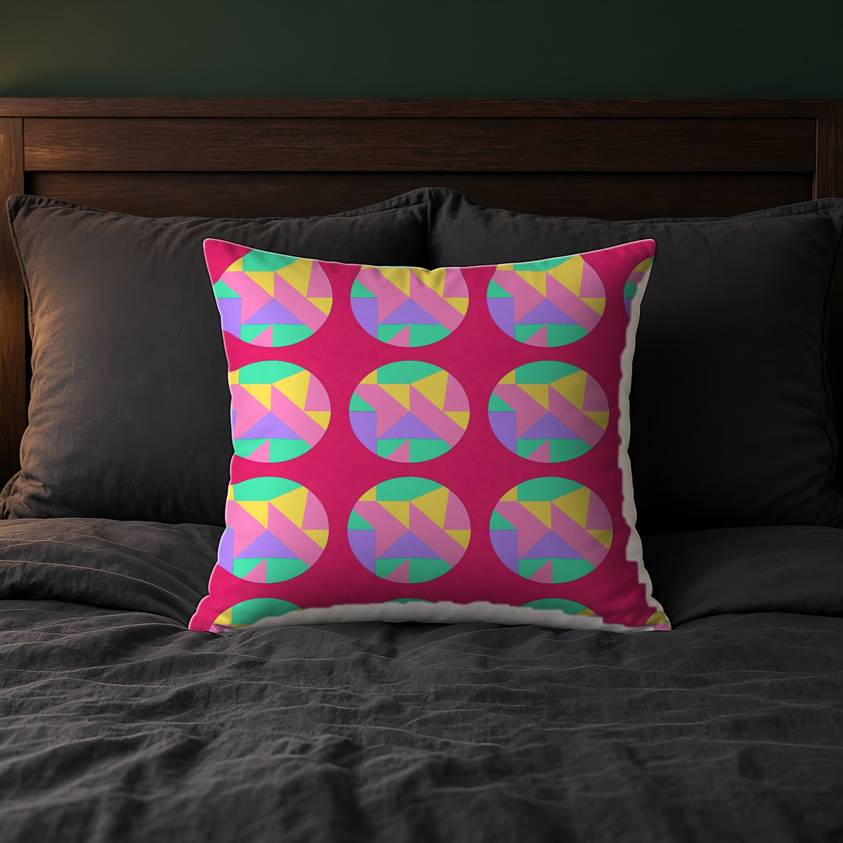Broken Circle Planes Faux Suede Cushion in Candy Pop on Raspberry on a bed with charcoal bedding