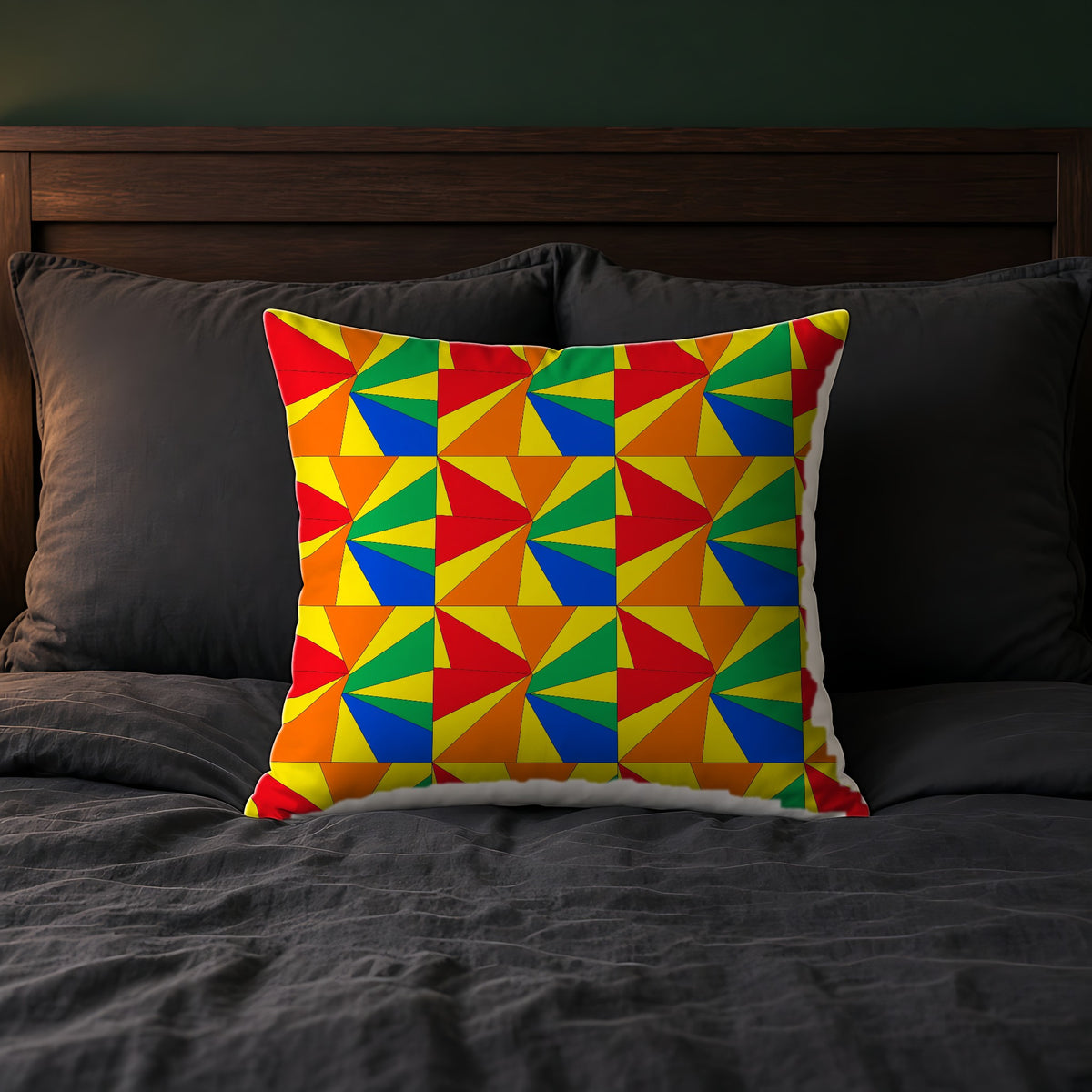 Cubist Sunburst Blocks Faux Suede Cushion on a bed with charcoal bedding