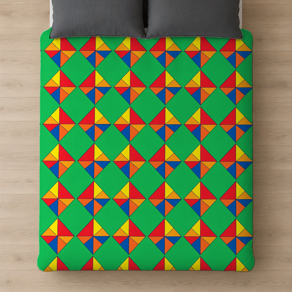 Cubist Kite Quartet Cotton Duvet Cover on a bed, seen from above