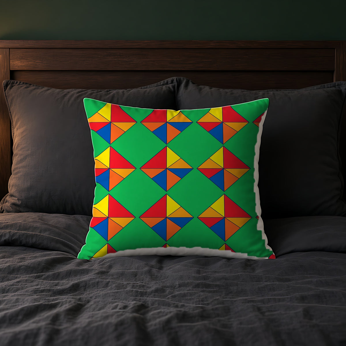 Cubist Kite Quartet Faux Suede Cushion on a bed with charcoal bedding
