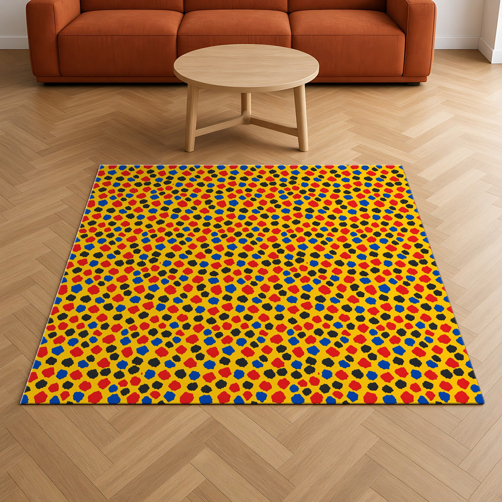 Confetti Scraps Yellow Outdoor Rug on a herringbone wood floor in a living room