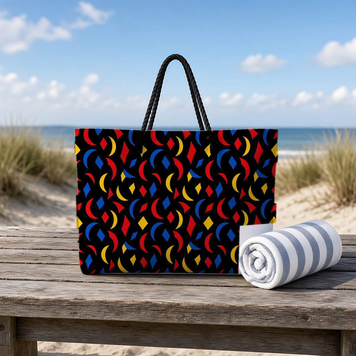 Crescent Scatter Weekender Tote Bag on a rustic table by the beach