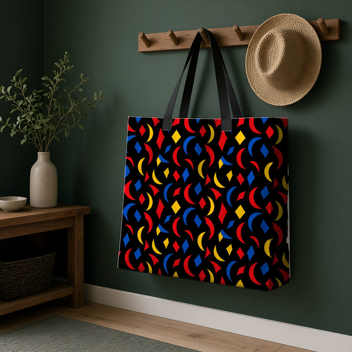 Crescent Scatter Weekender Tote Bag hanging on a peg rail in a green hallway
