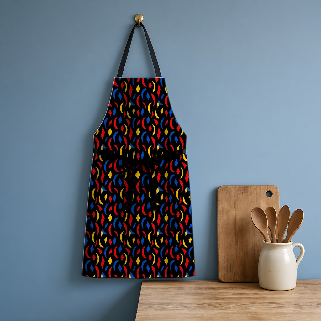 Crescent Scatter Apron hanging in a blue kitchen