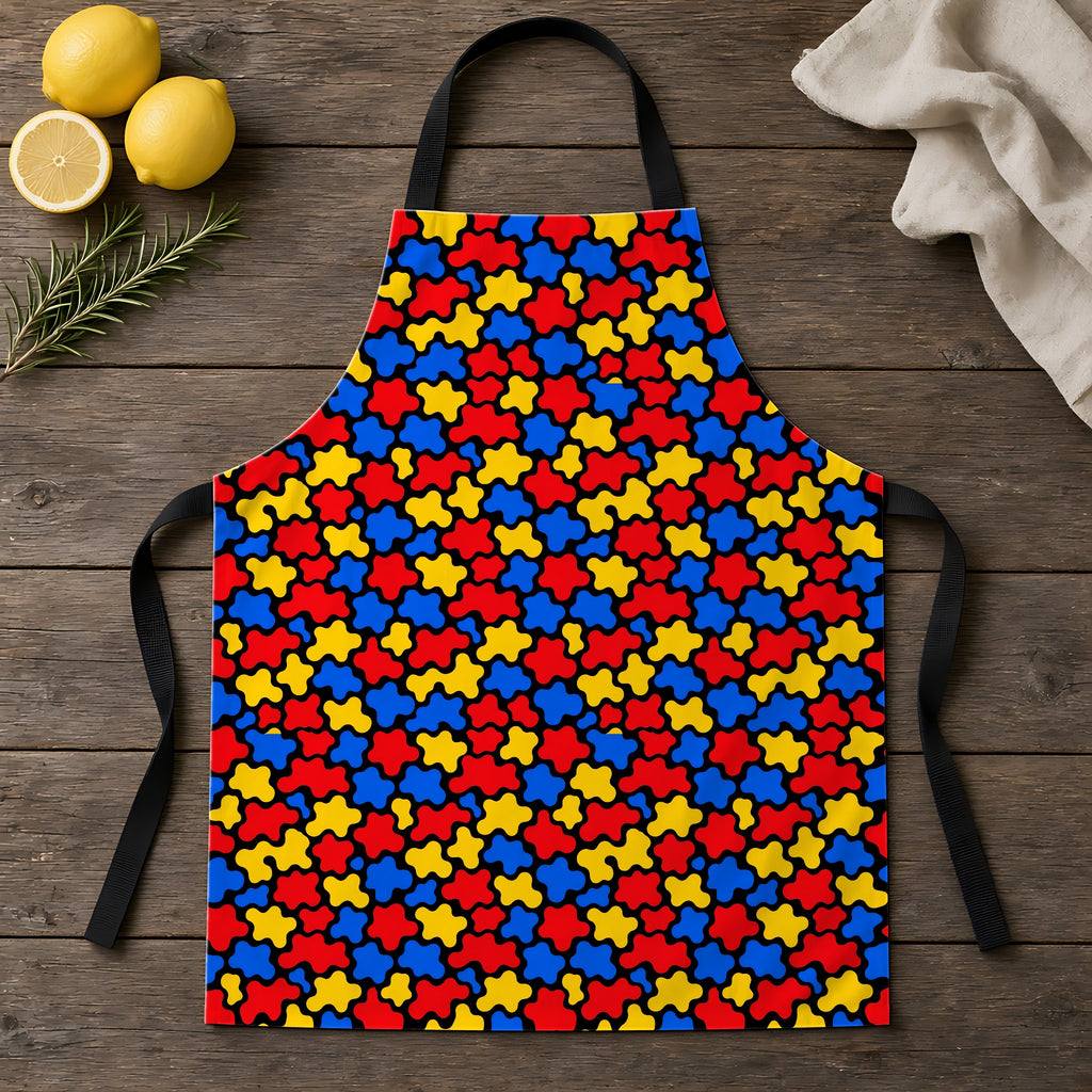 Blob Black Apron laid flat on a rustic wooden table