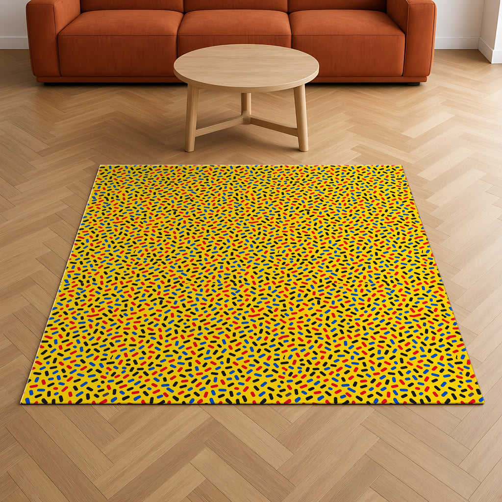 Sprinkle Pop Outdoor Rug on a herringbone wood floor in a living room