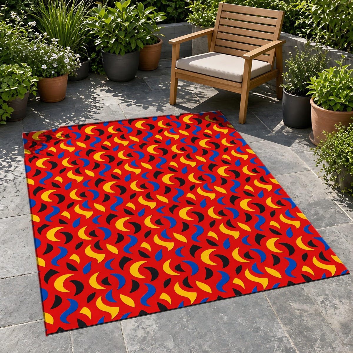 Swoosh Cutouts Outdoor Rug on a stone patio with potted plants
