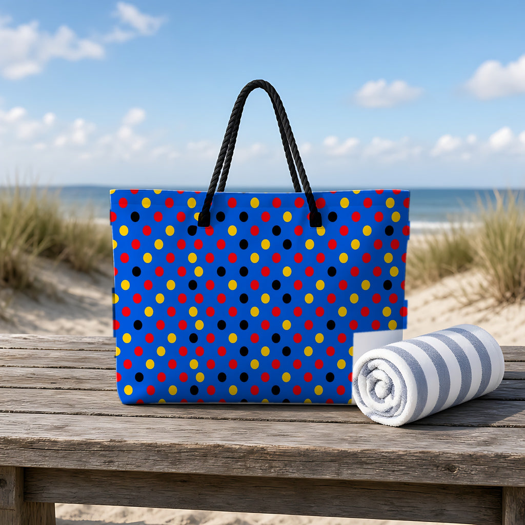 Dot Scatter Blue Weekender Tote Bag on a rustic table by the beach