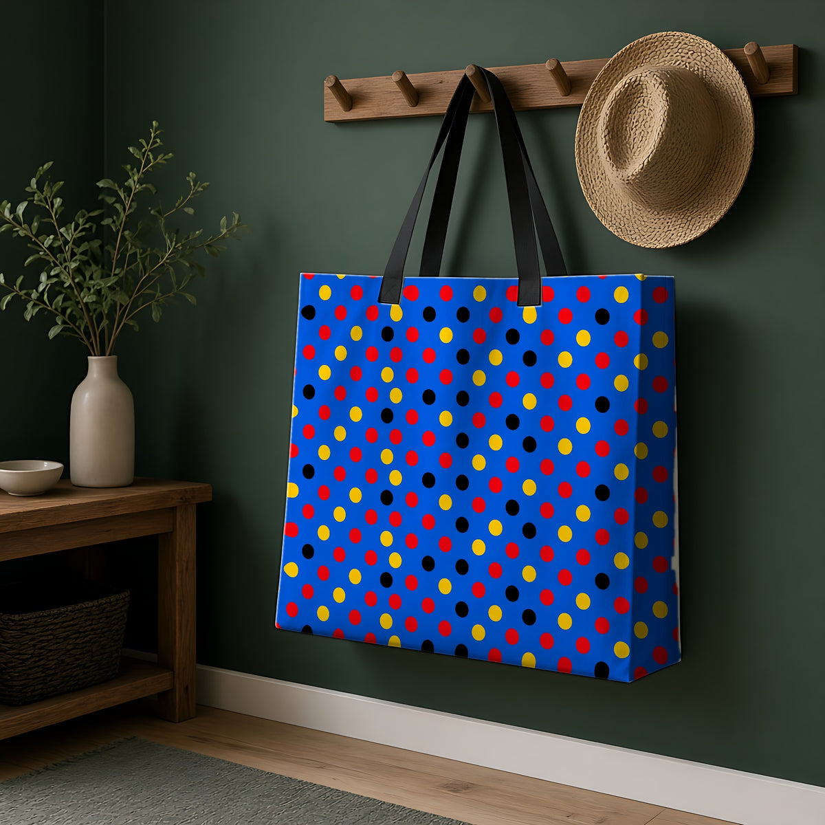 Dot Scatter Blue Weekender Tote Bag hanging on a peg rail in a green hallway