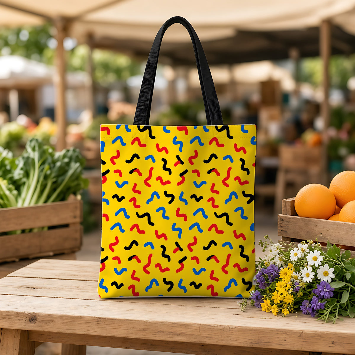 Squiggle Strokes Yellow Weekender Tote Bag on a wooden bench at a farmers market