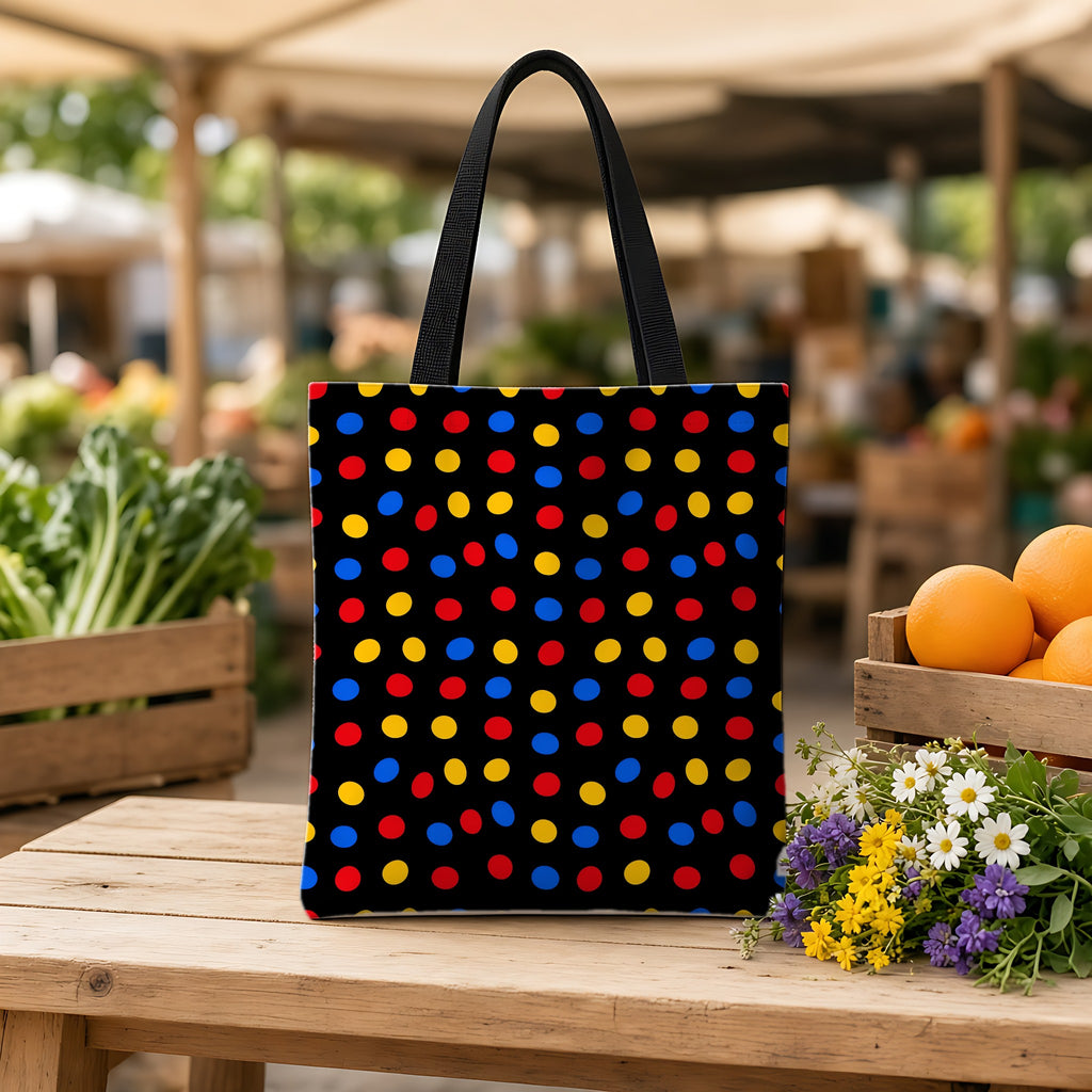 Pebble Scatter Black Weekender Tote Bag on a wooden bench at a farmers market