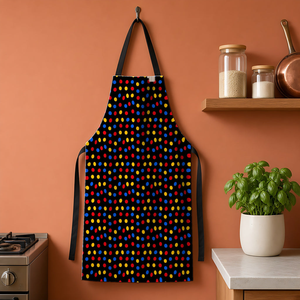 Pebble Scatter Black Apron hanging on a terracotta kitchen wall