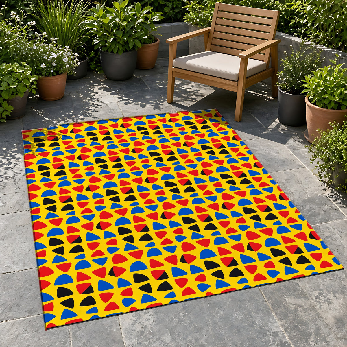 Cut-Out Arcs Yellow Outdoor Rug on a stone patio with potted plants