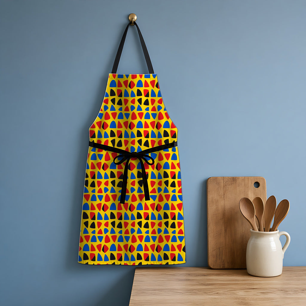 Cut-Out Arcs Yellow Apron hanging in a blue kitchen