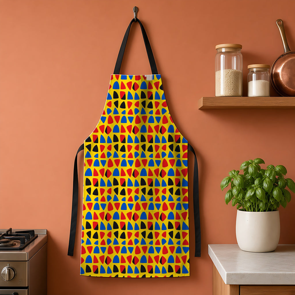 Cut-Out Arcs Yellow Apron hanging on a terracotta kitchen wall