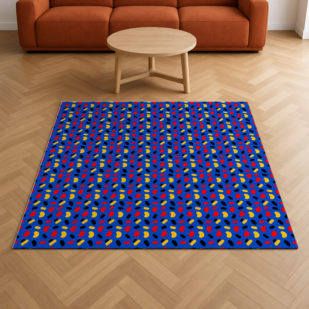 Bean Scatter Blue Outdoor Rug on a herringbone wood floor in a living room