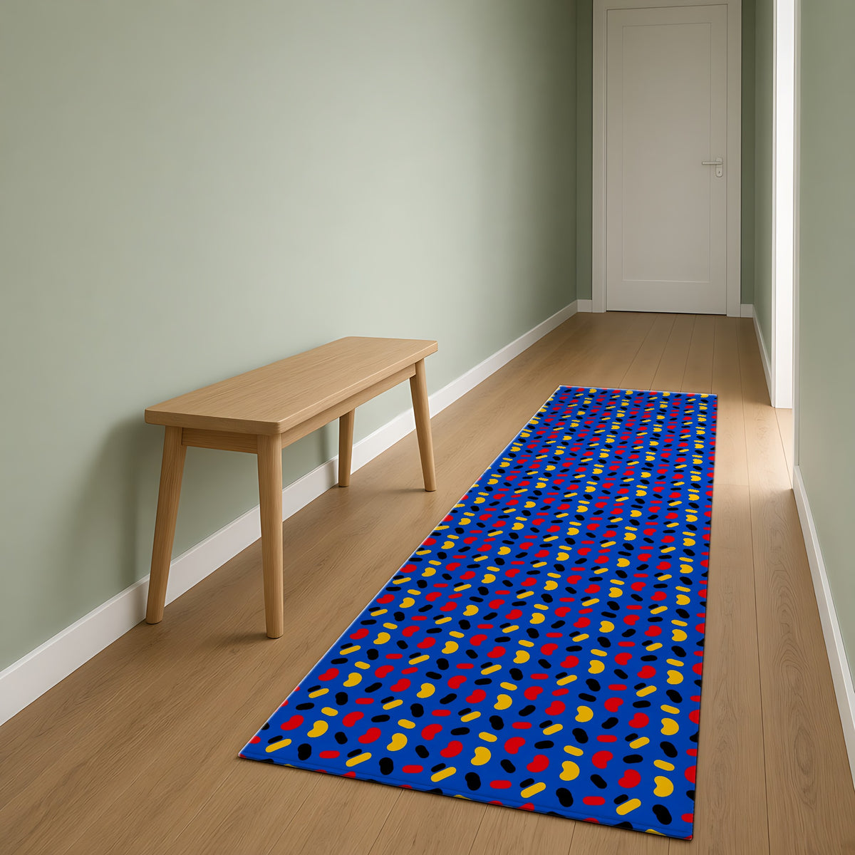 Bean Scatter Blue Outdoor Rug as a runner in a sage-green hallway