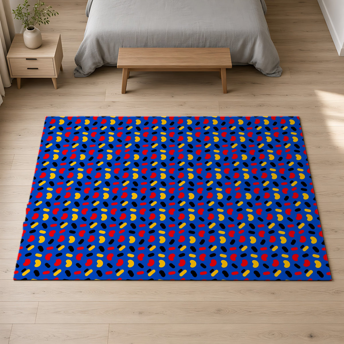 Bean Scatter Blue Outdoor Rug on a pale oak floor in a calm bedroom