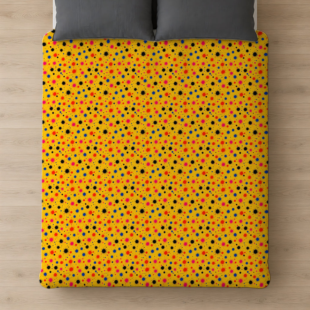 Saffron Splat Storm Cotton Duvet Cover on a bed, seen from above