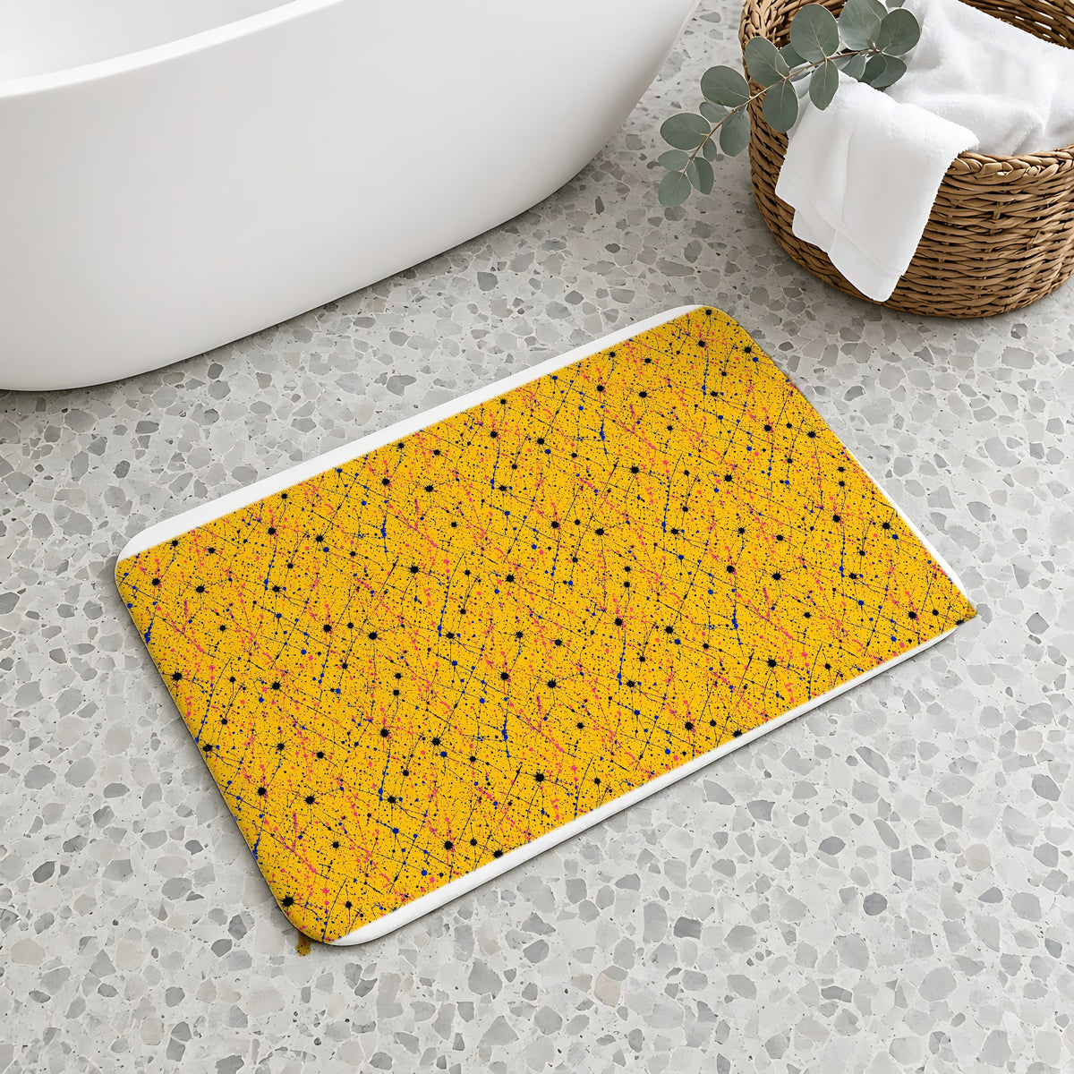 Drip Trails Bath Mat on a terrazzo floor beside a freestanding bath