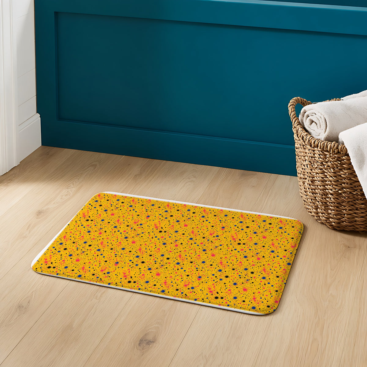 Pink Spray Field Bath Mat on an oak floor in a teal bathroom