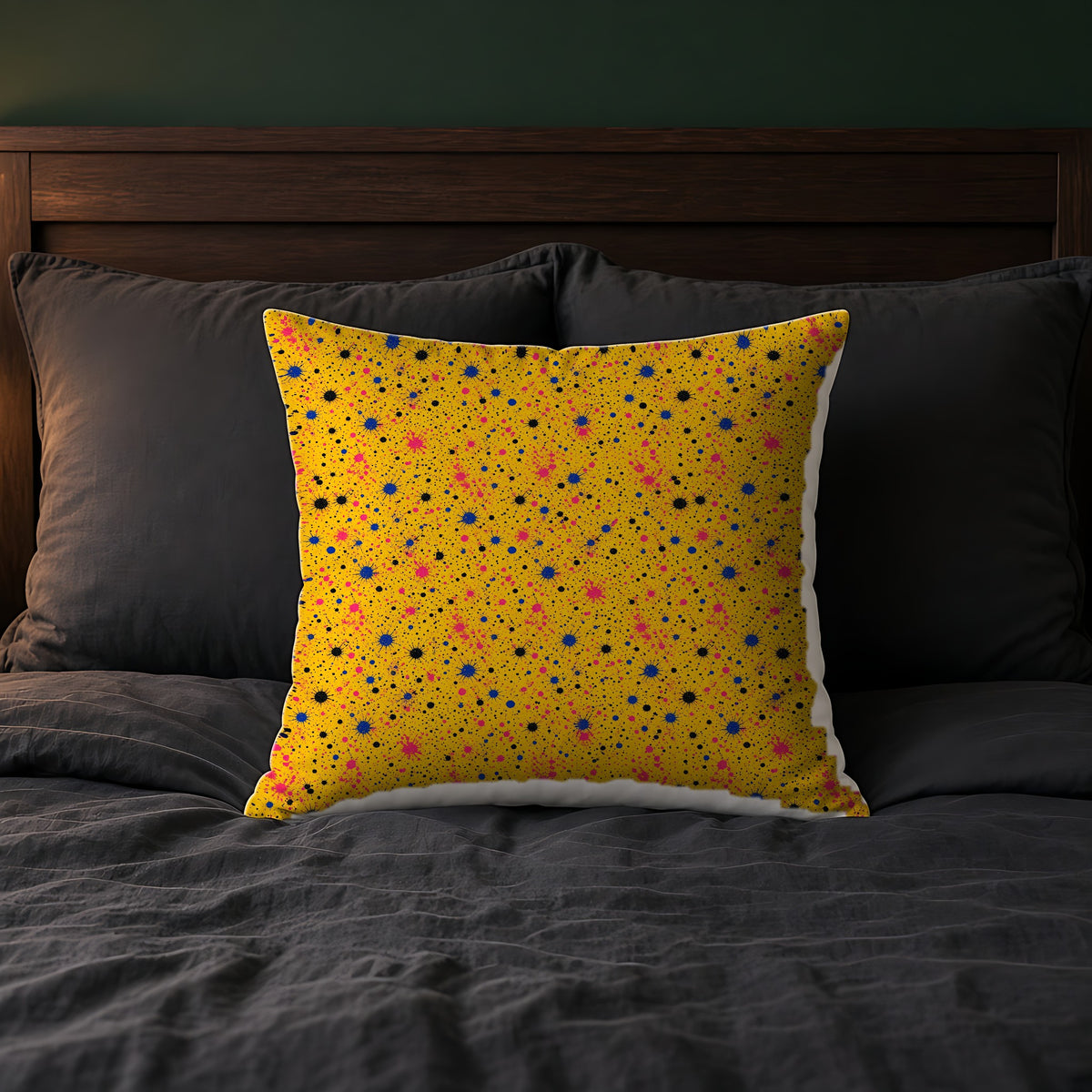 Pink Spray Field Faux Suede Cushion on a bed with charcoal bedding