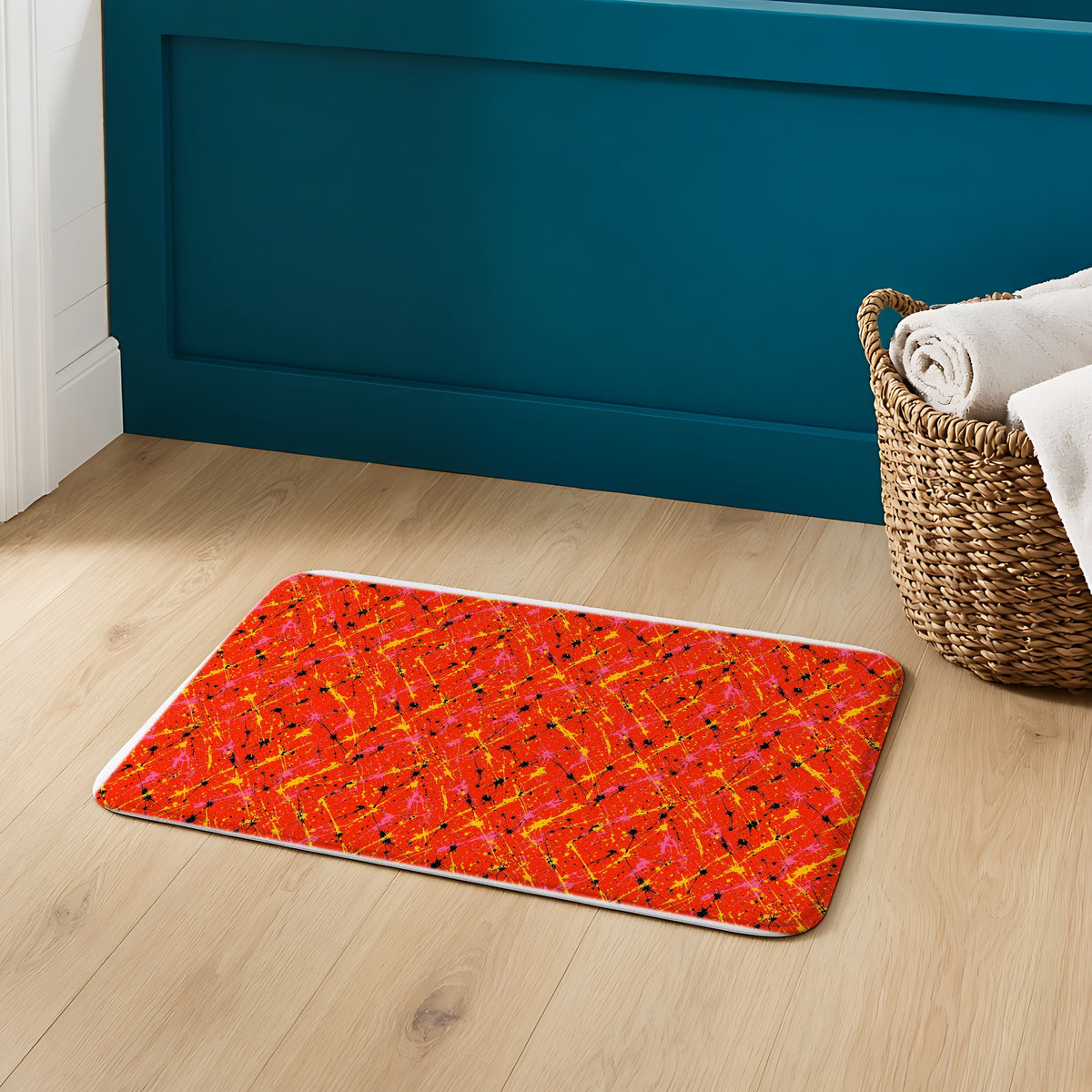 Vermilion Riot Bath Mat on an oak floor in a teal bathroom