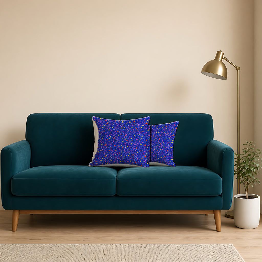 Ultramarine Spatter Faux Suede Cushion on a teal velvet sofa