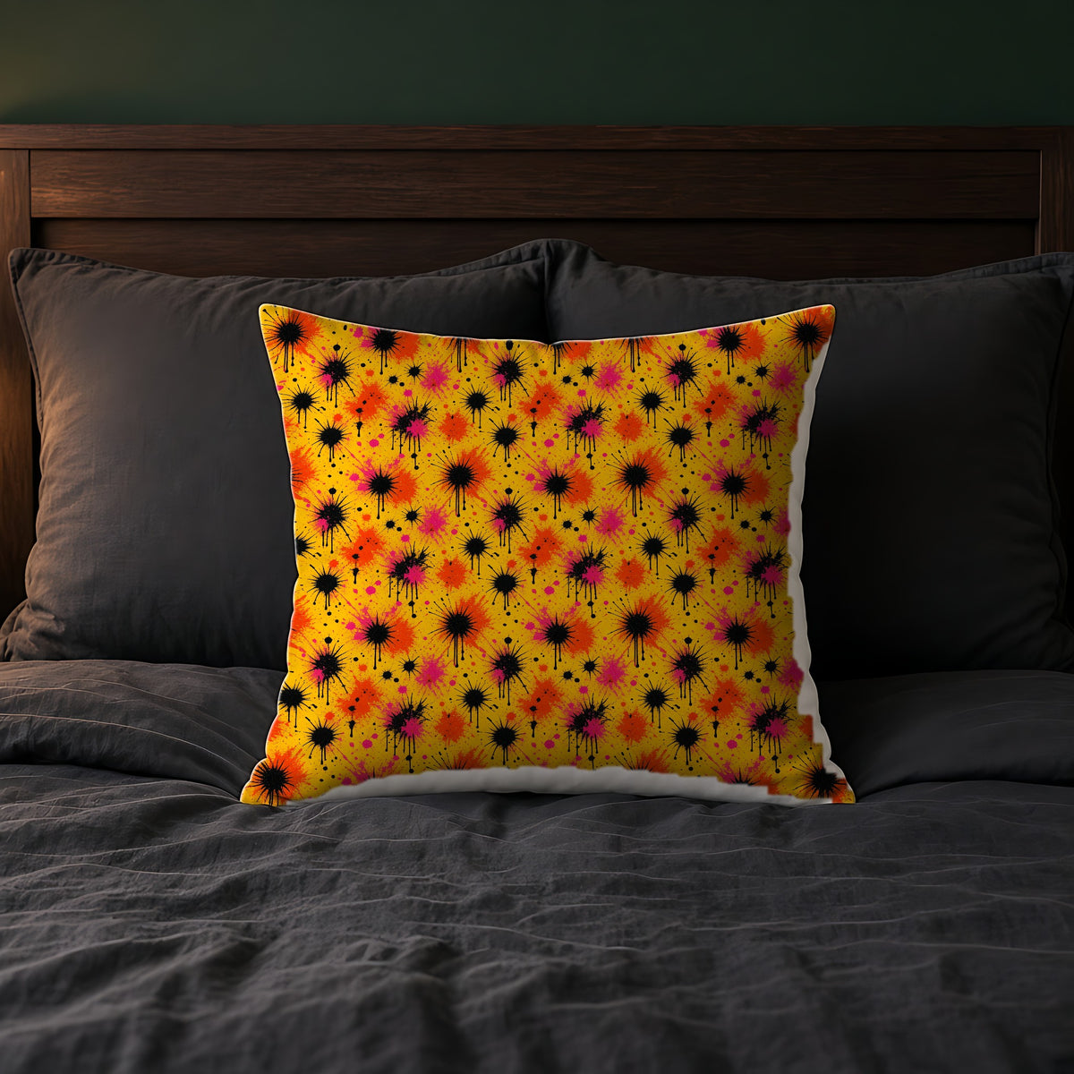 Black Ink Burst Faux Suede Cushion on a bed with charcoal bedding