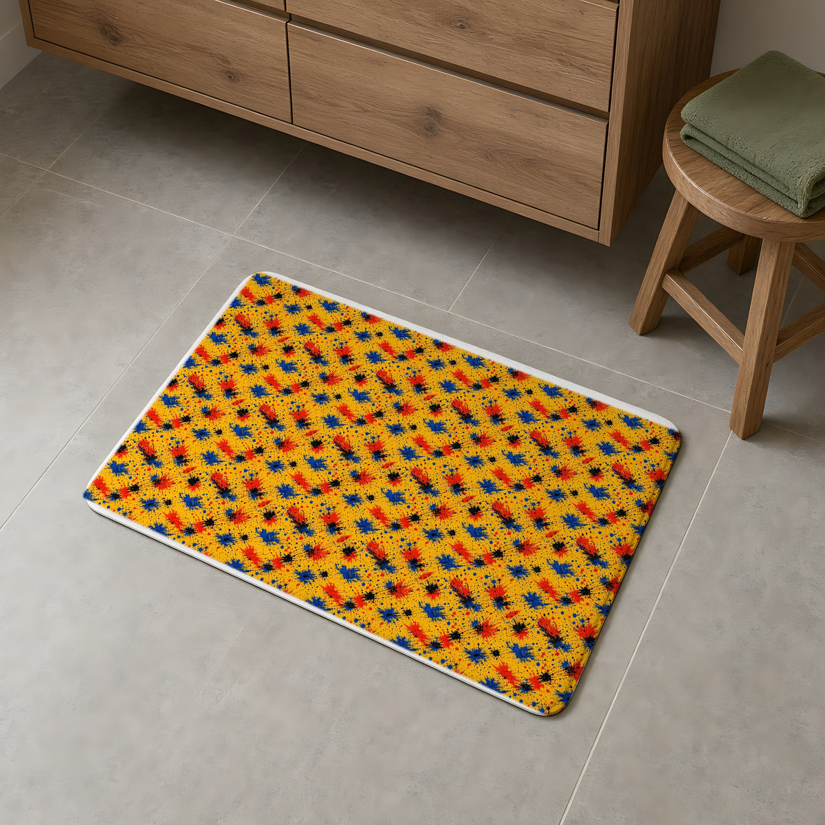 Dragged Smears Bath Mat on a grey tiled bathroom floor