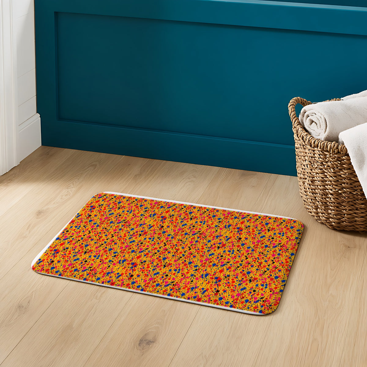 Layered Drip Spray Bath Mat on an oak floor in a teal bathroom