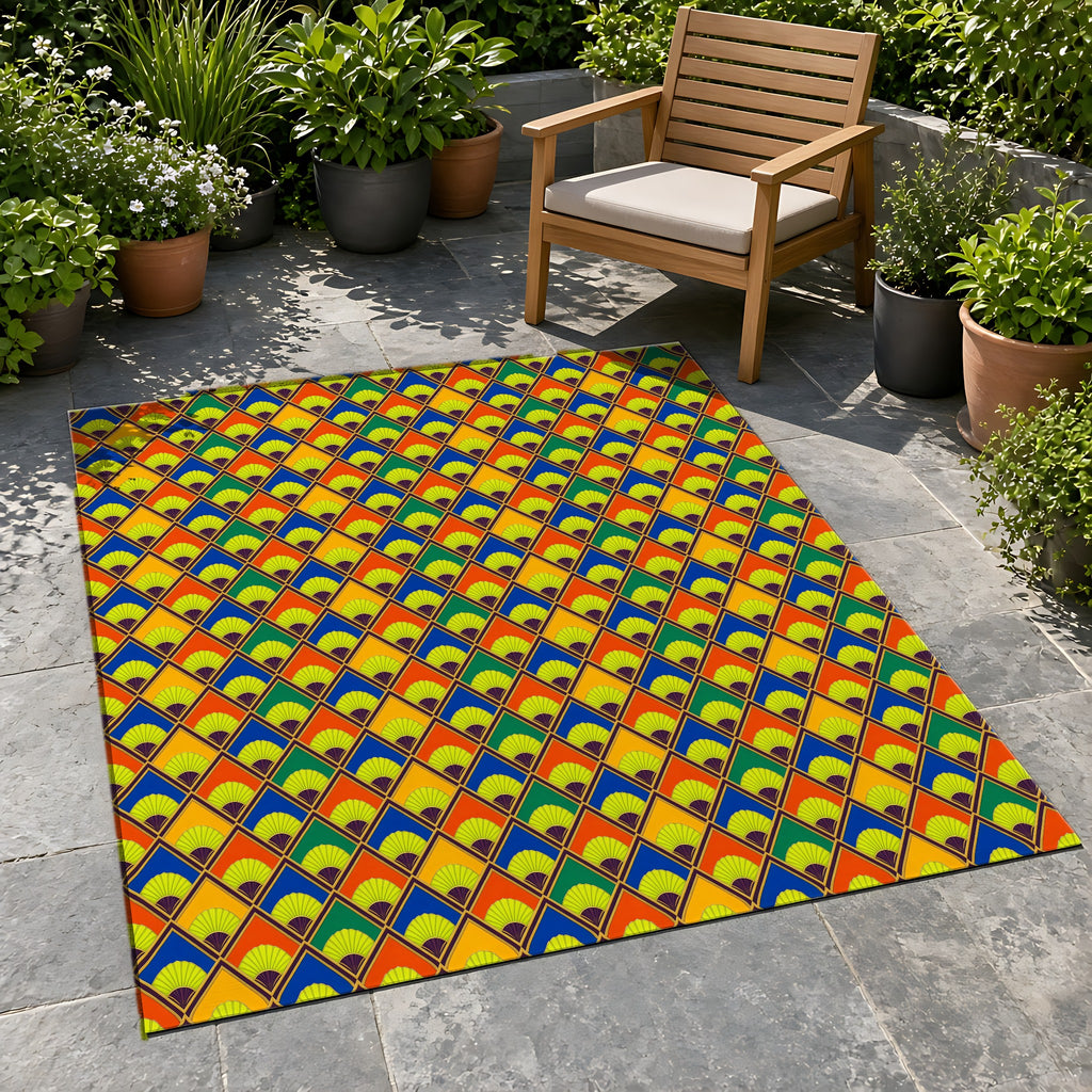 Fanfare Harlequin Outdoor Rug on a stone patio with potted plants