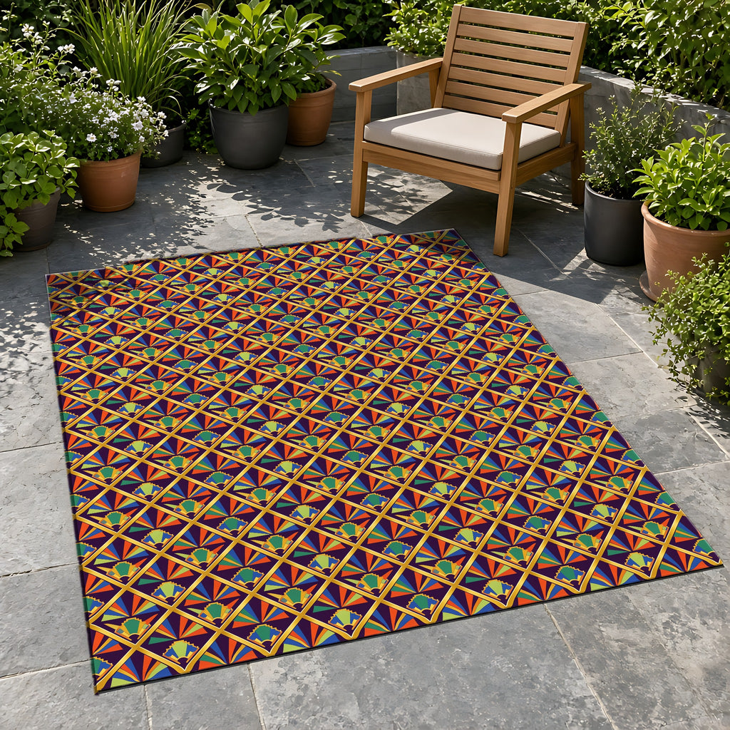 Gilded Lattice Sunburst Outdoor Rug on a stone patio with potted plants