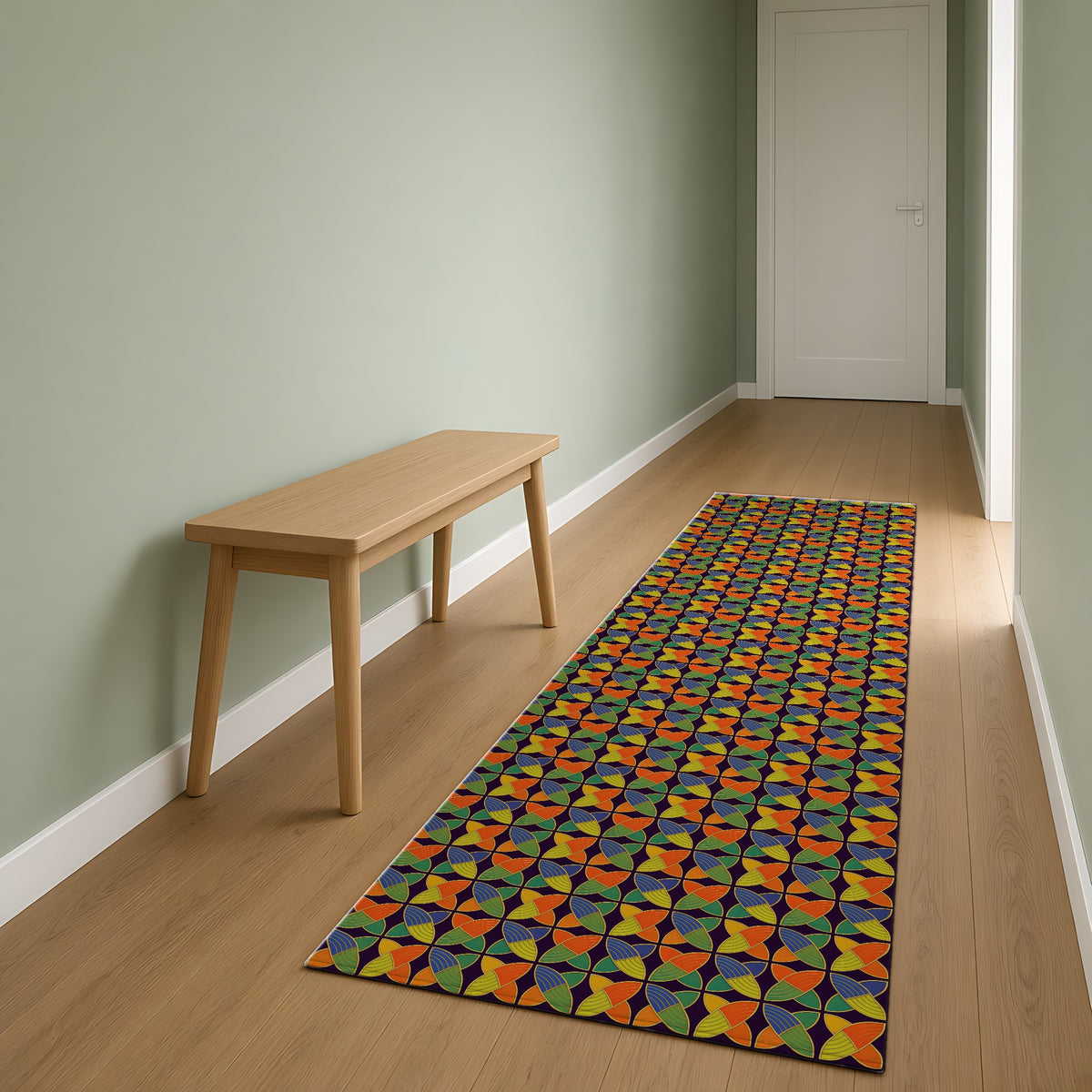Woven Petal Quatrefoil Outdoor Rug as a runner in a sage-green hallway