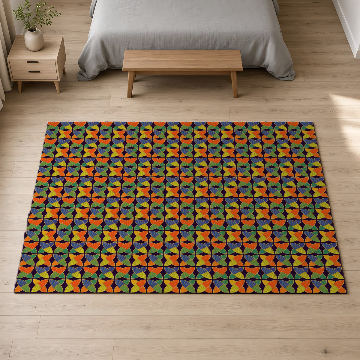 Woven Petal Quatrefoil Outdoor Rug on a pale oak floor in a calm bedroom