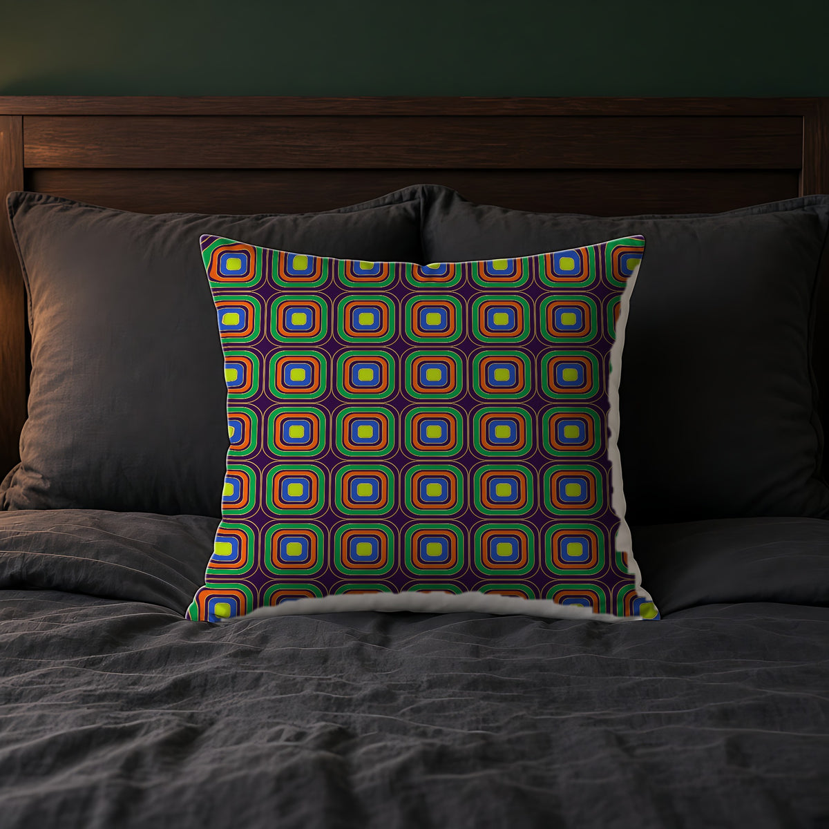 Op-Deco Nested Squares Faux Suede Cushion on a bed with charcoal bedding