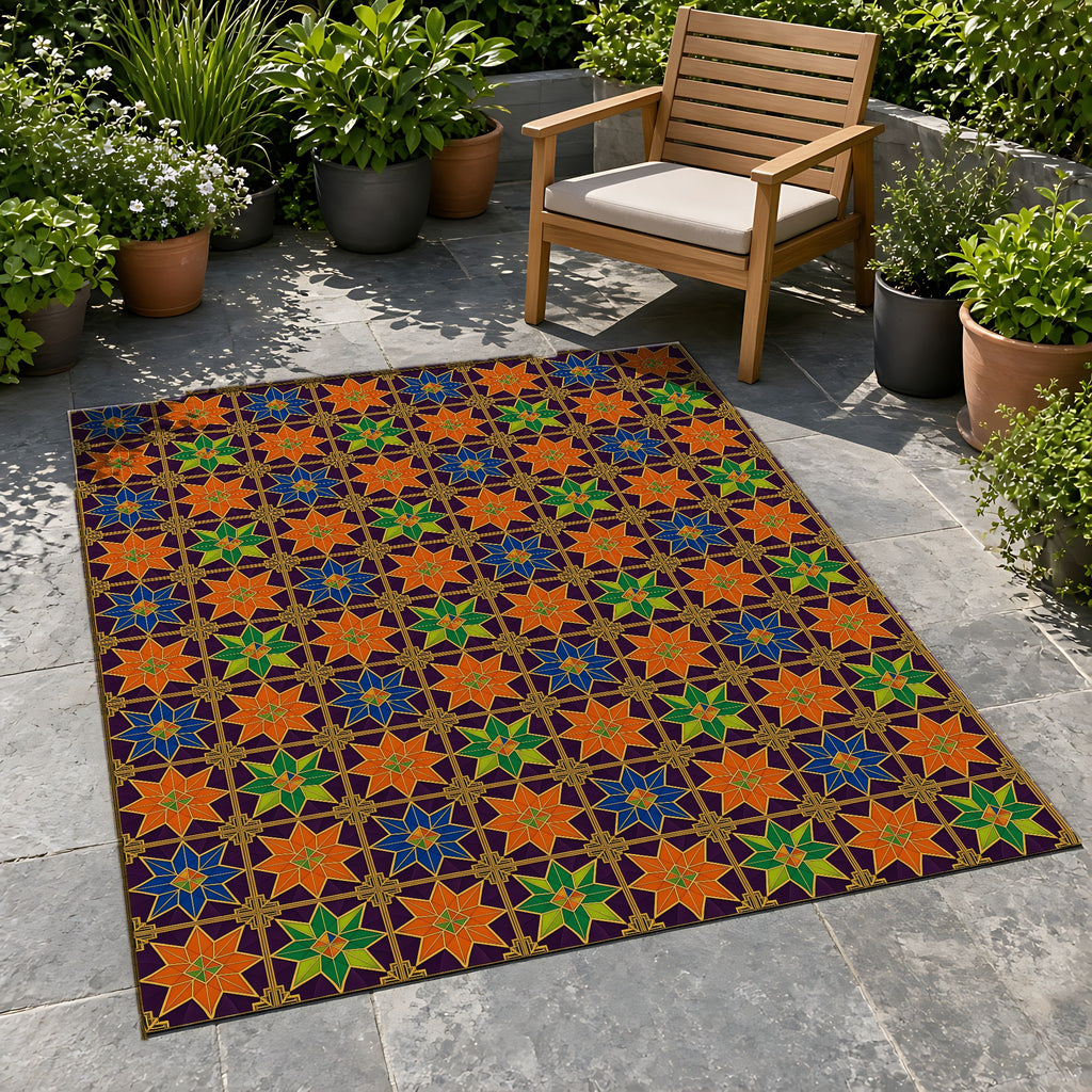 Deco Star Tiles Outdoor Rug on a stone patio with potted plants