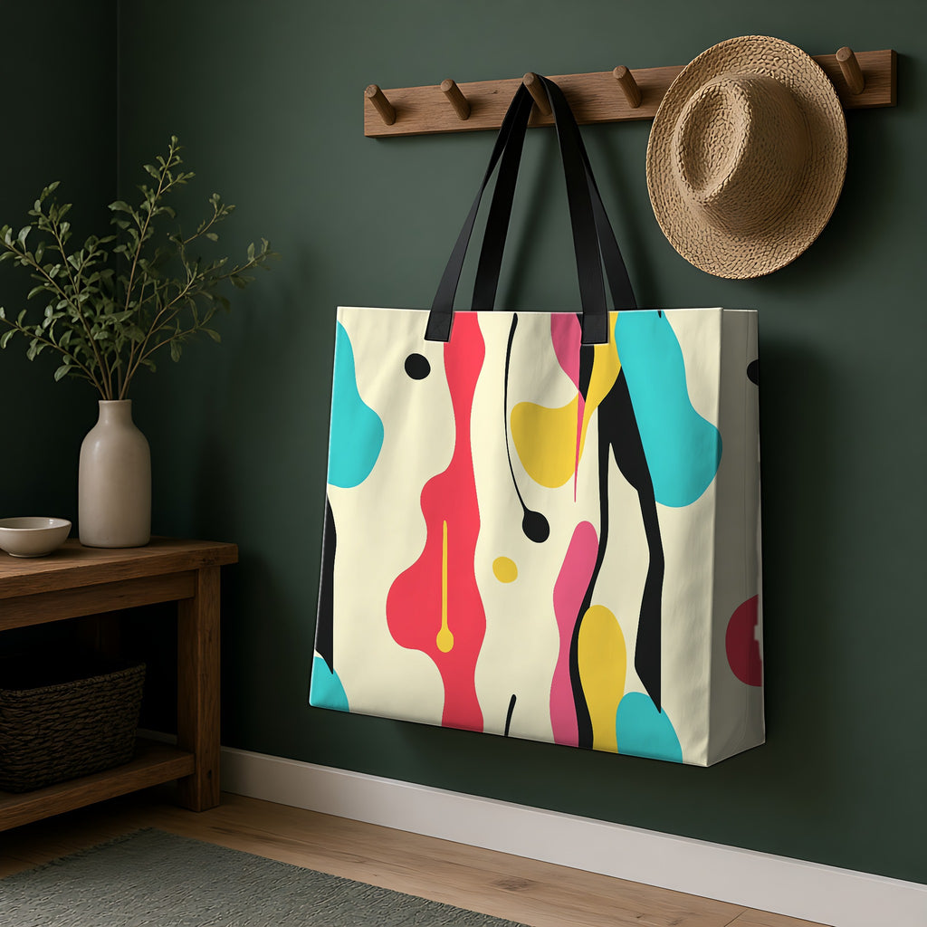 Cut-Out Blobs Weekender Tote Bag hanging on a peg rail in a green hallway