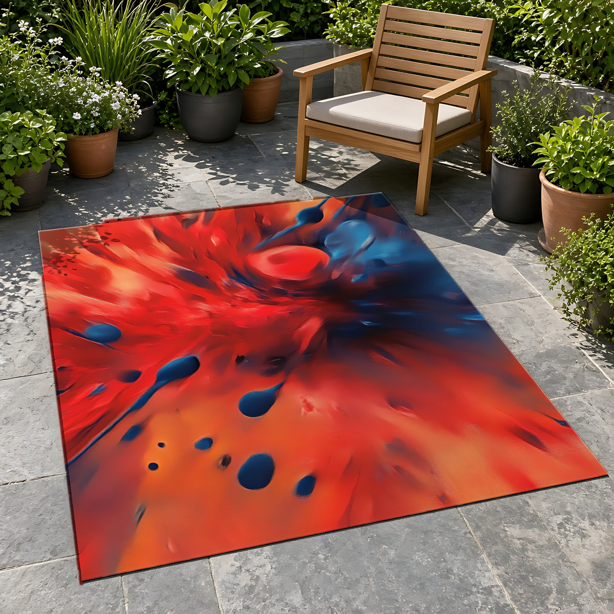 Scarlet Blue Blast Outdoor Rug on a stone patio with potted plants