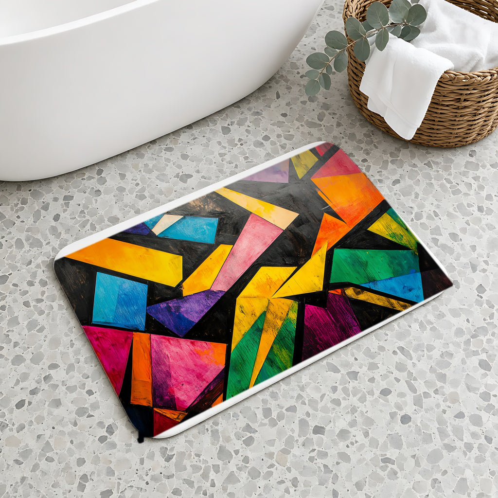 Shattered Prism Geometry Bath Mat on a terrazzo floor beside a freestanding bath