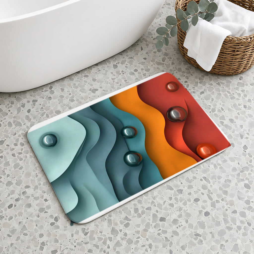Teal Coral Waves Bath Mat on a terrazzo floor beside a freestanding bath