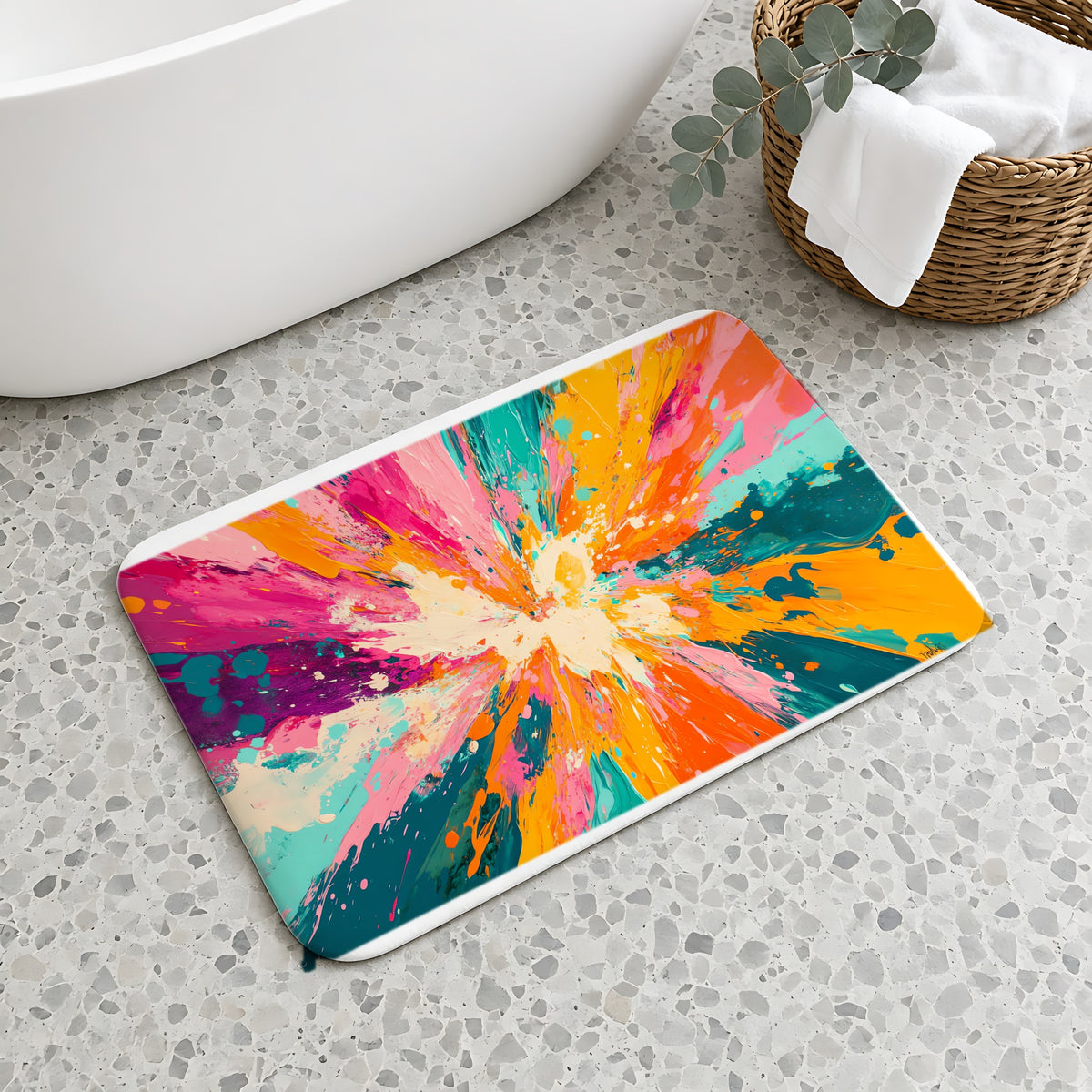 Sunburst Splash Bath Mat on a terrazzo floor beside a freestanding bath