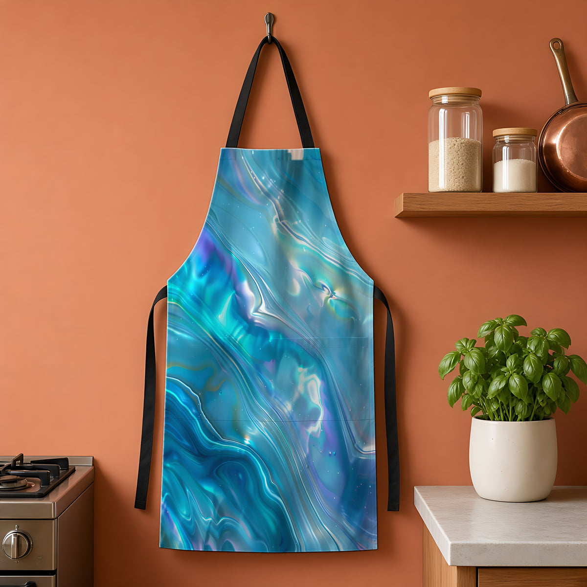Aqua Holographic Ripple Apron hanging on a terracotta kitchen wall