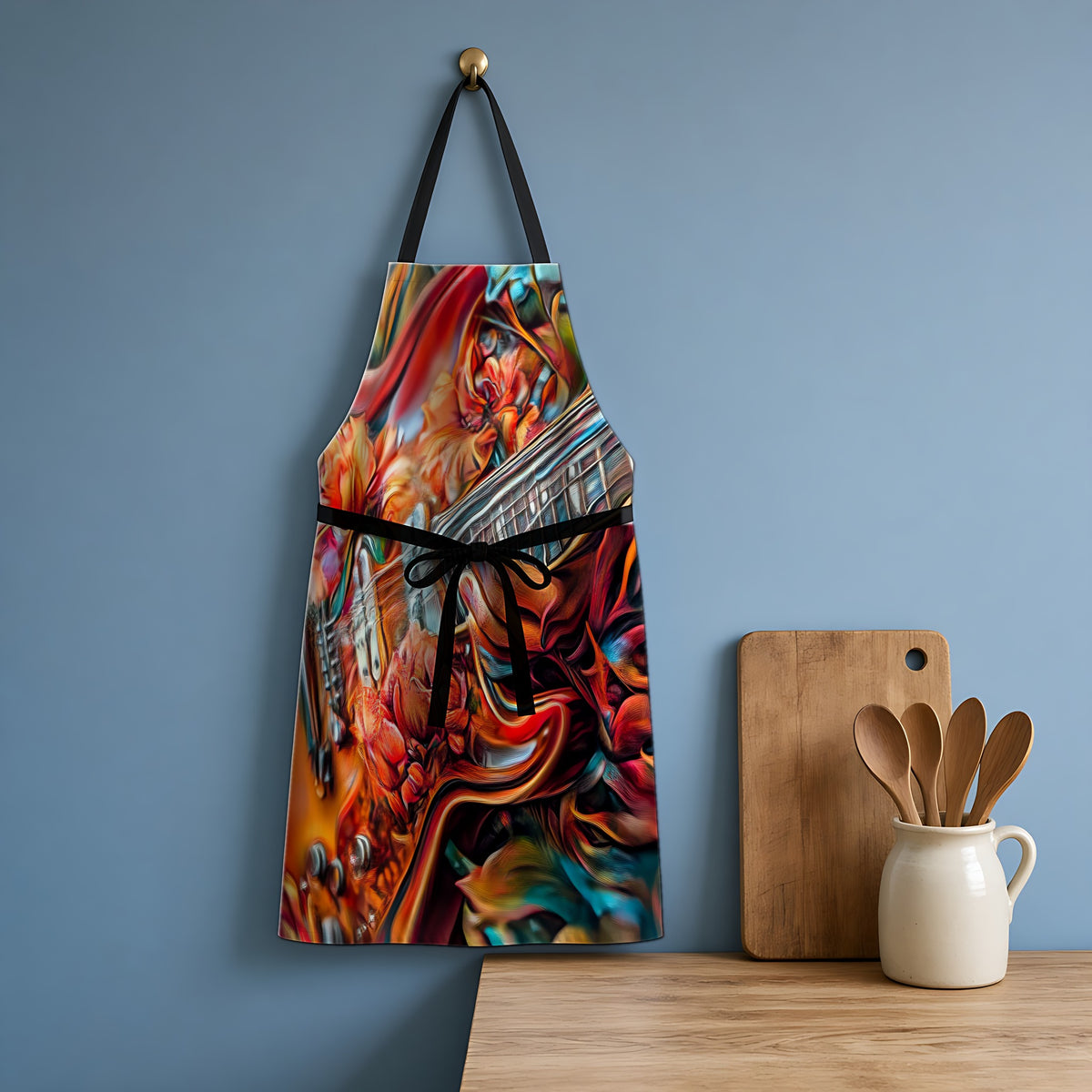 Floral Rock Guitar Apron hanging in a blue kitchen